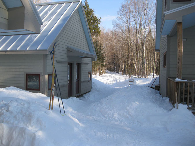 Snowy exterior of Poplar Stream Hut.