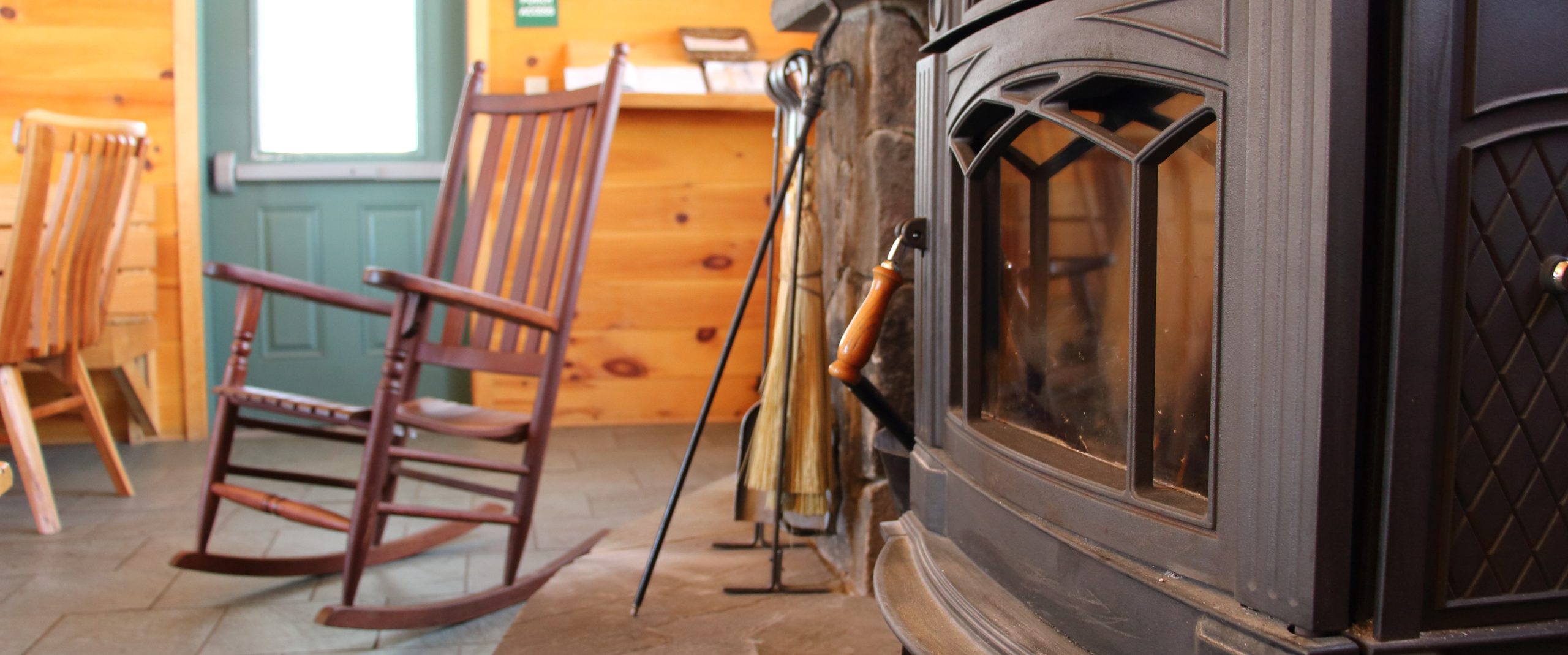 The wood stove and rocking chair at Flagstaff Lake Hut.