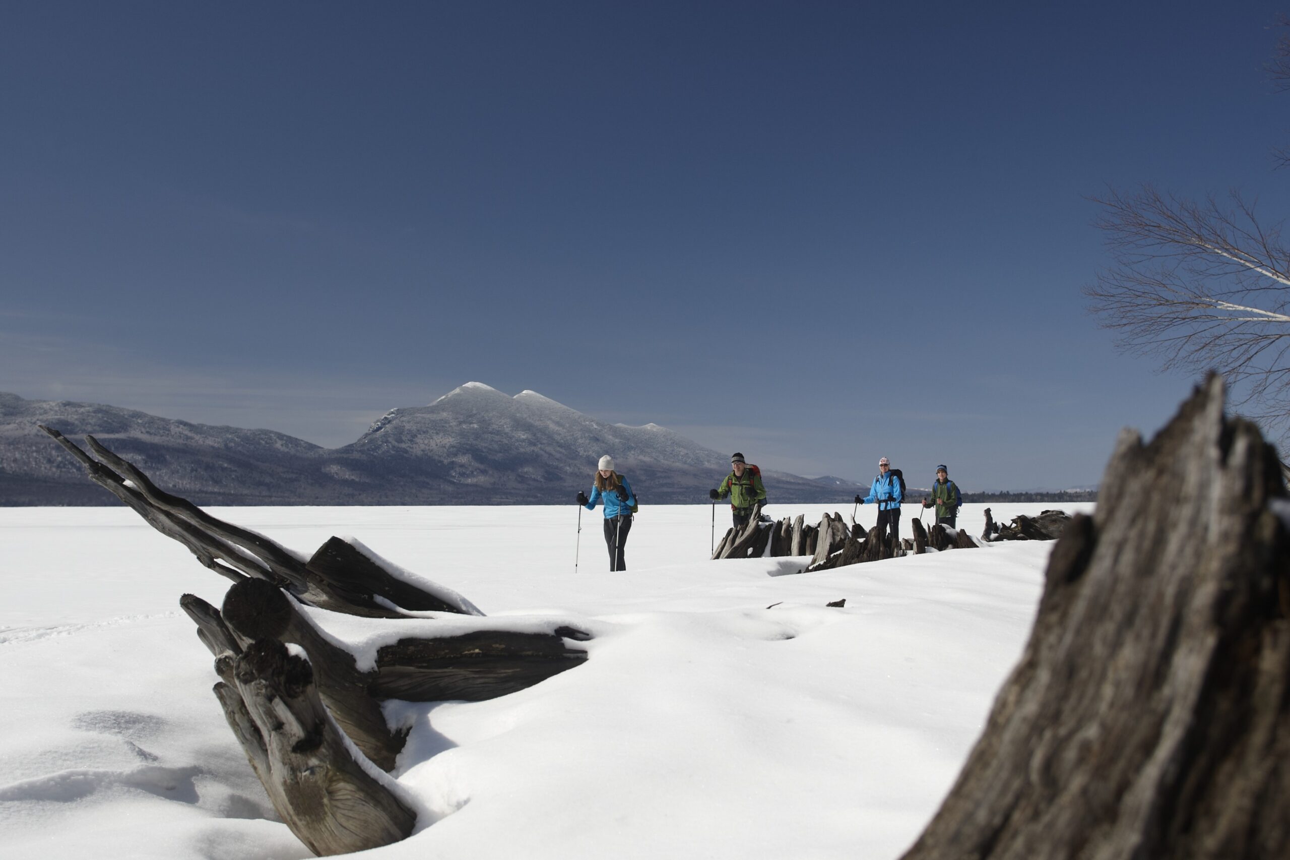 Snowshoeing on Flagstaff Lake with the Bigelow Range in the background.