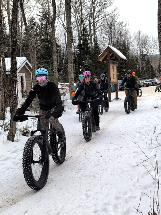 Group of fat bikers leaving the Rt 27/Stratton Brook Trailhead.