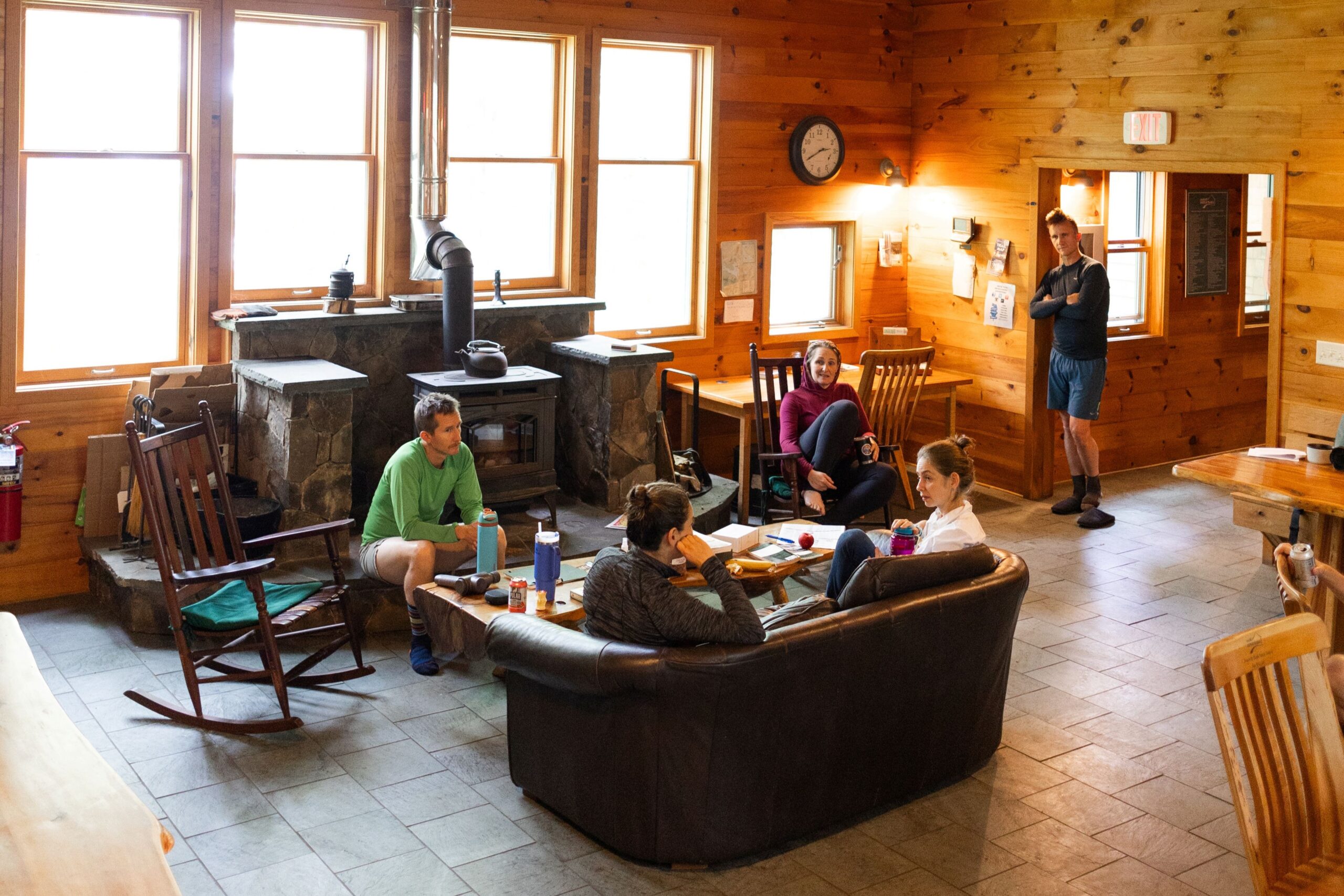 Guests relaxing in the Flagstaff Lake Hut Great Room.