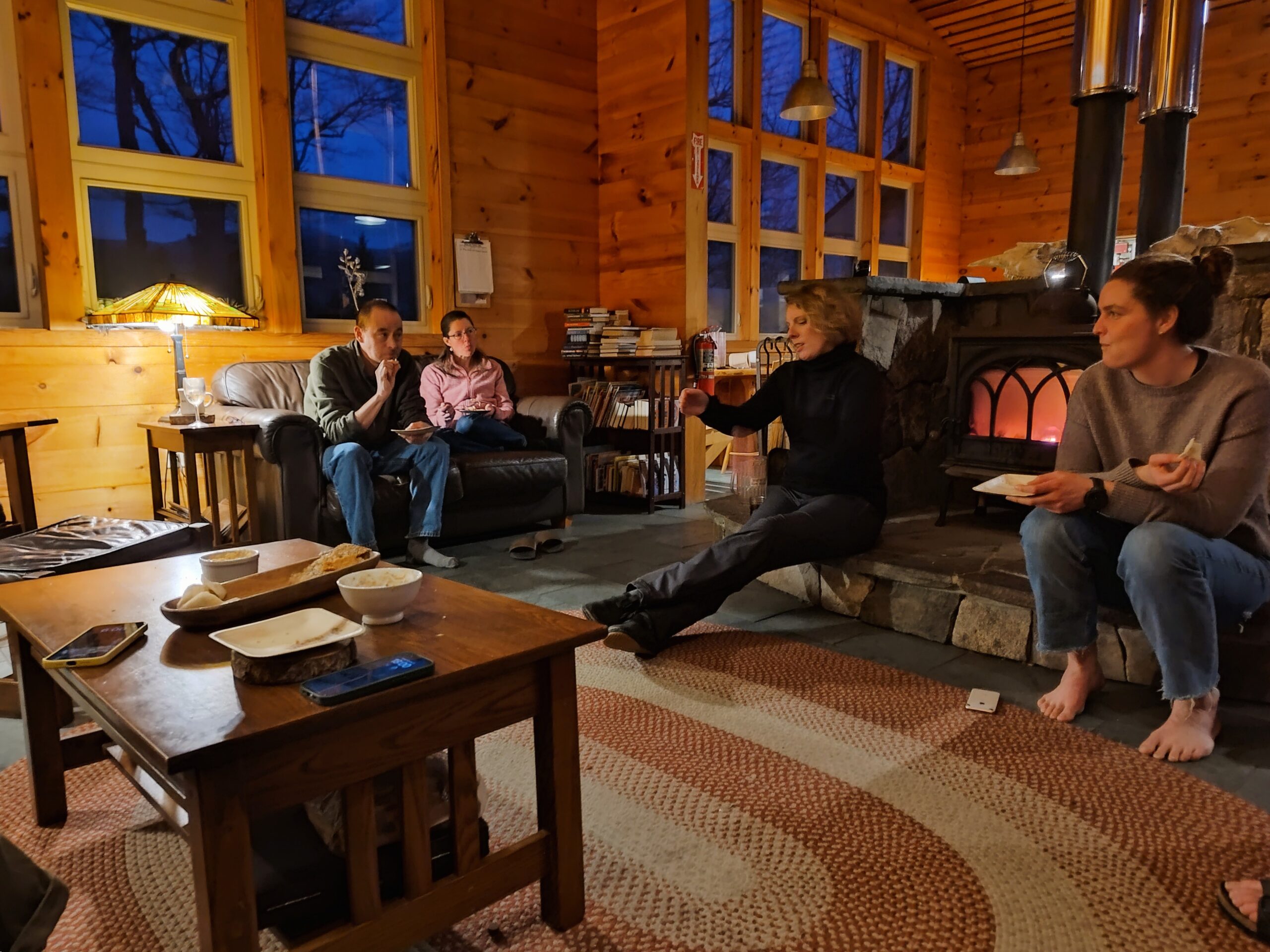 Guests in the lounge at the Alpine Dinner at Stratton Brook Hut.