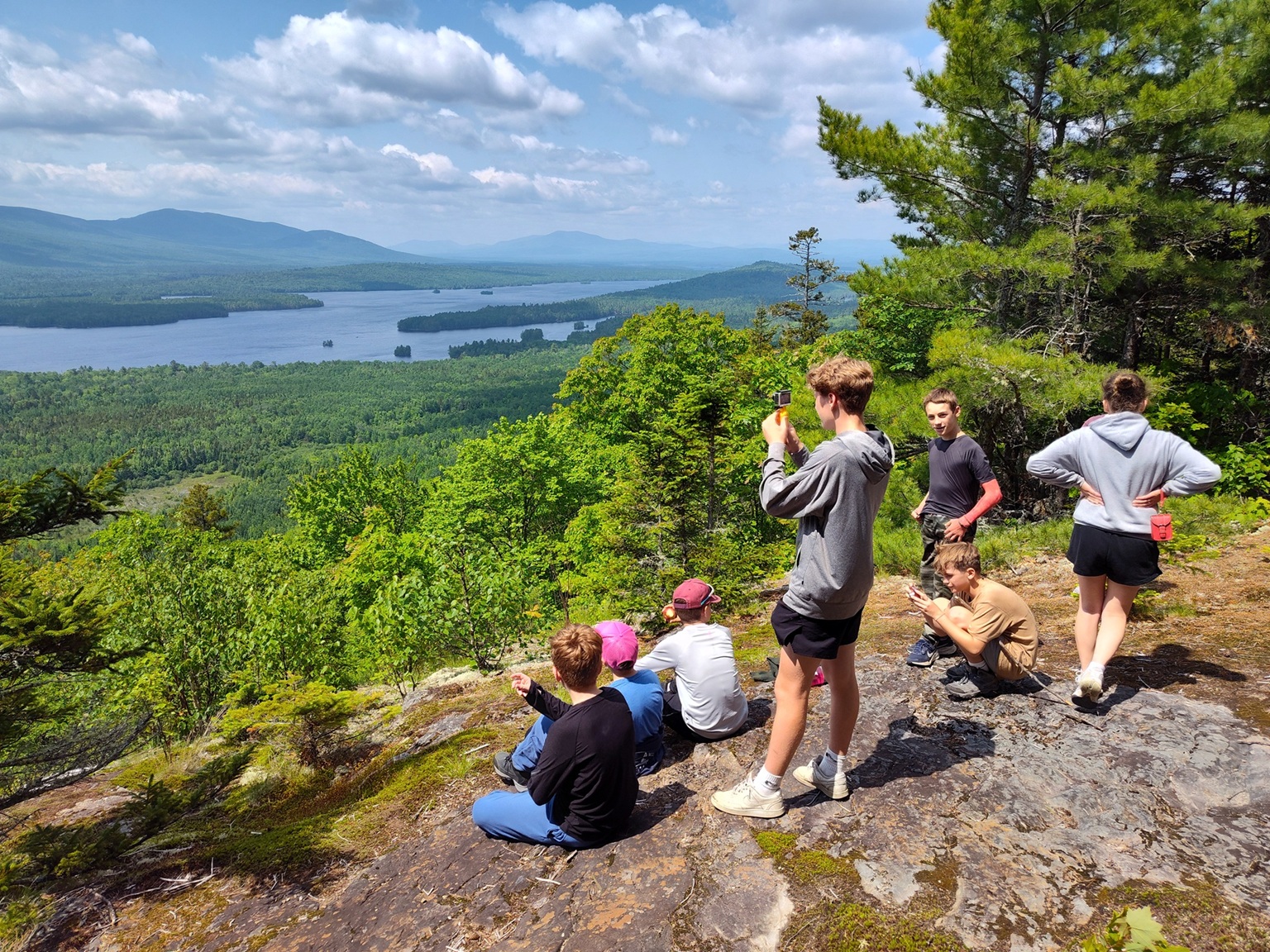 Youth group hiking around Flagstaff Lake